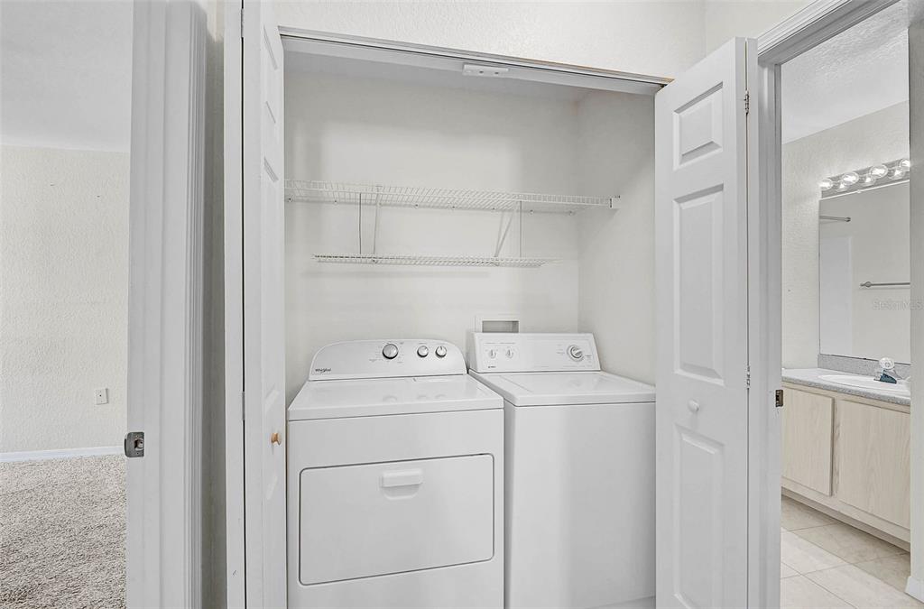 8827 Manor Loop, Unit 204 Lakewood Ranch, FL 34202 - Photo 20 of 31 a utility room with dryer and washer
