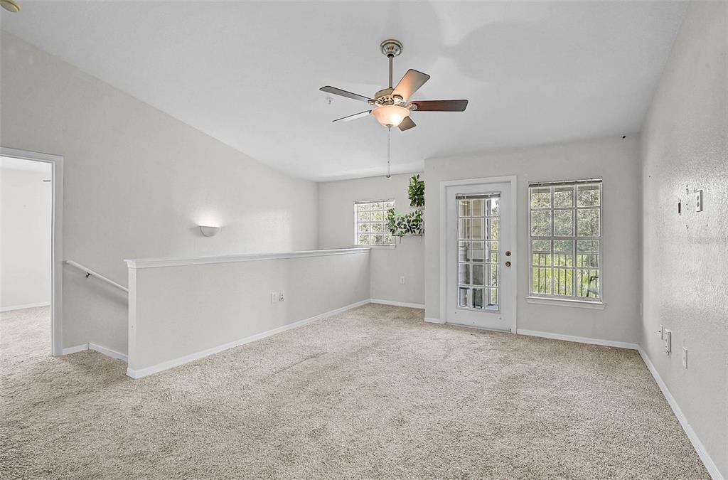 8827 Manor Loop, Unit 204 Lakewood Ranch, FL 34202 - Photo 5 of 31 a view of an empty room with a window