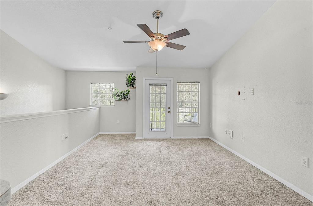 8827 Manor Loop, Unit 204 Lakewood Ranch, FL 34202 - Photo 6 of 31 a view of an empty room with a window