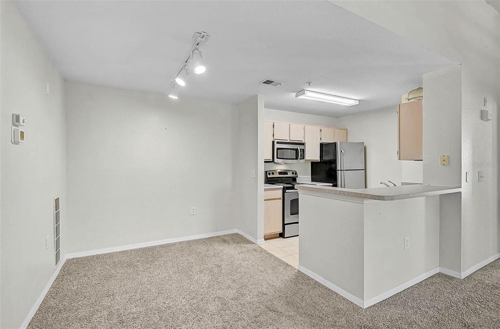 8827 Manor Loop, Unit 204 Lakewood Ranch, FL 34202 - Photo 8 of 31 a view of kitchen with refrigerator sink and microwave