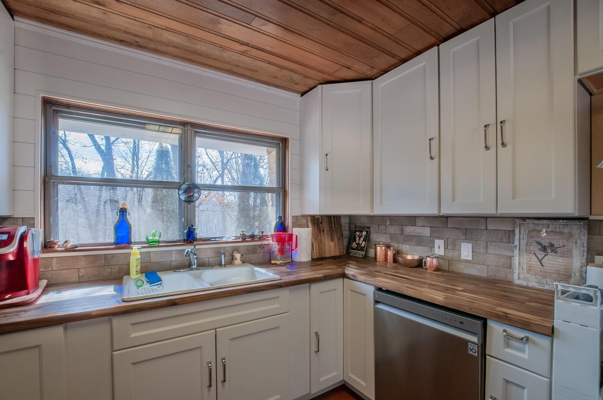 386 Fredericksburg Road Lexington, VA 24450 - Photo 20 of 72 a kitchen with stainless steel appliances granite countertop a sink a stove and cabinets
