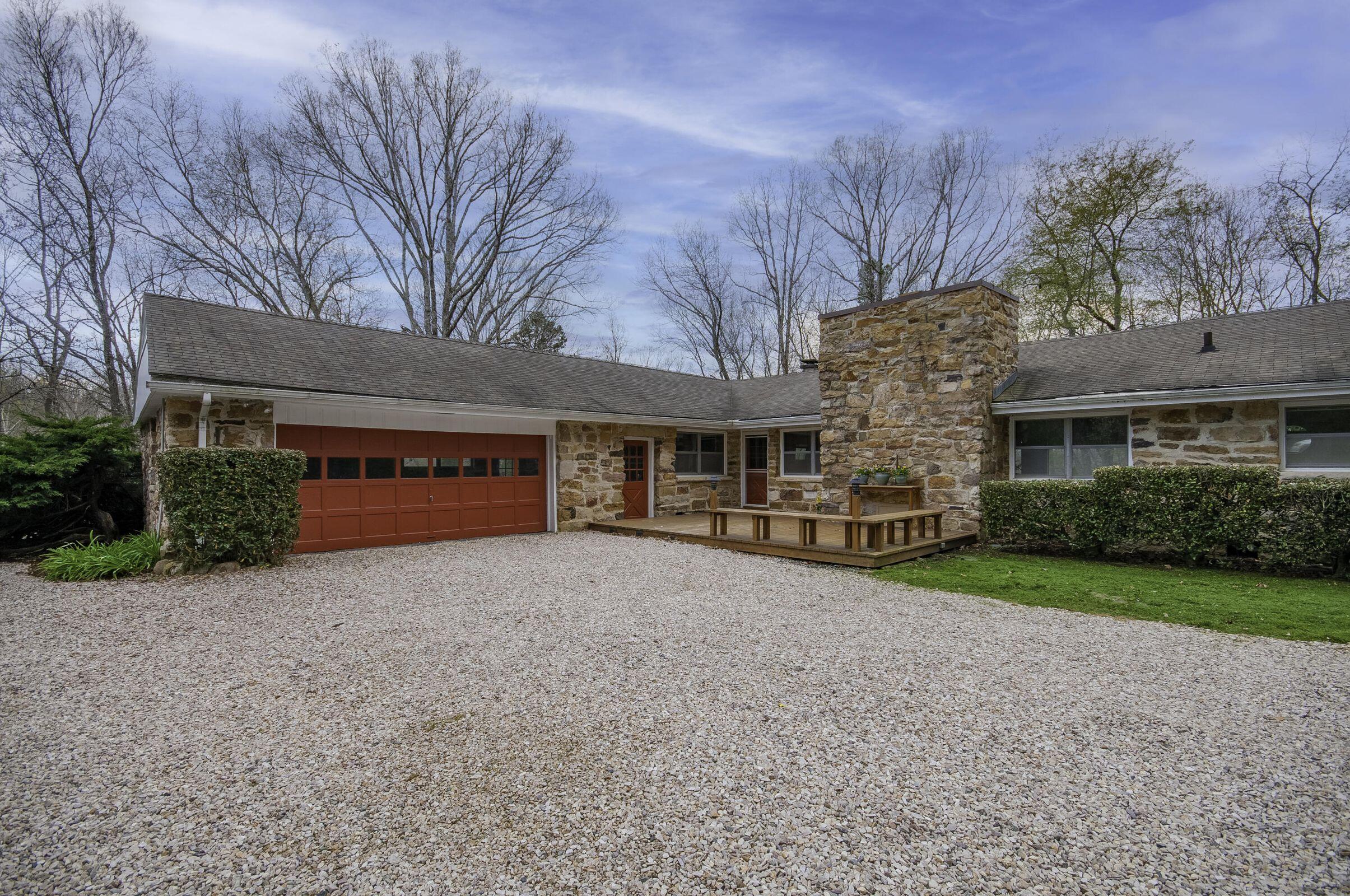 386 Fredericksburg Road Lexington, VA 24450 - Photo 2 of 72 a front view of a house with a yard and garage