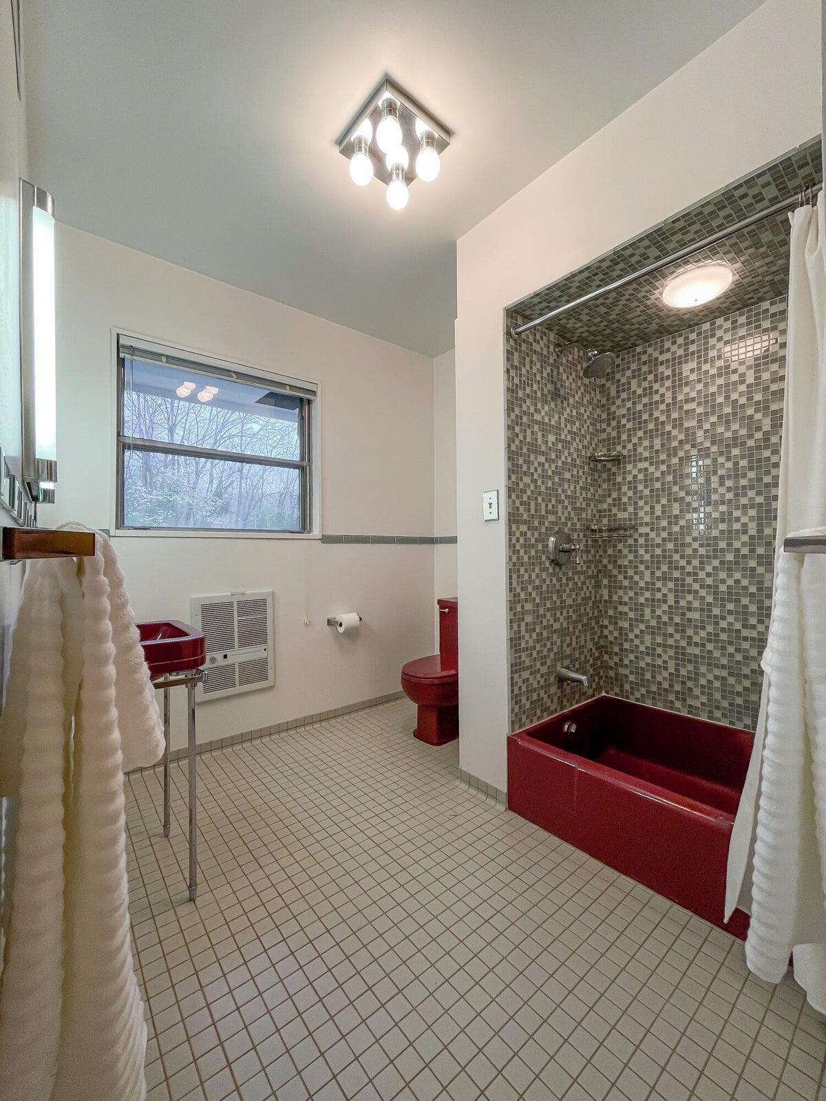 386 Fredericksburg Road Lexington, VA 24450 - Photo 31 of 72 a bedroom with a bed and a chandelier