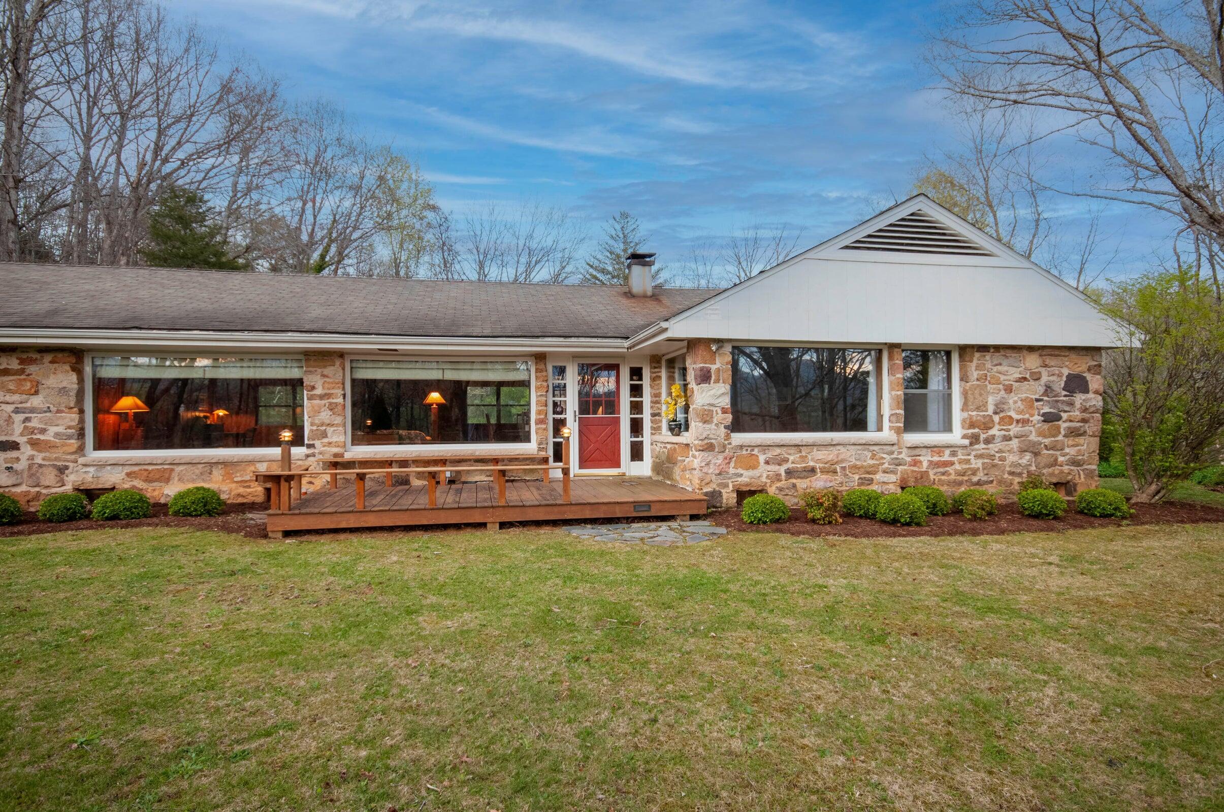 386 Fredericksburg Road Lexington, VA 24450 - Photo 4 of 72 a front view of a house with a garden