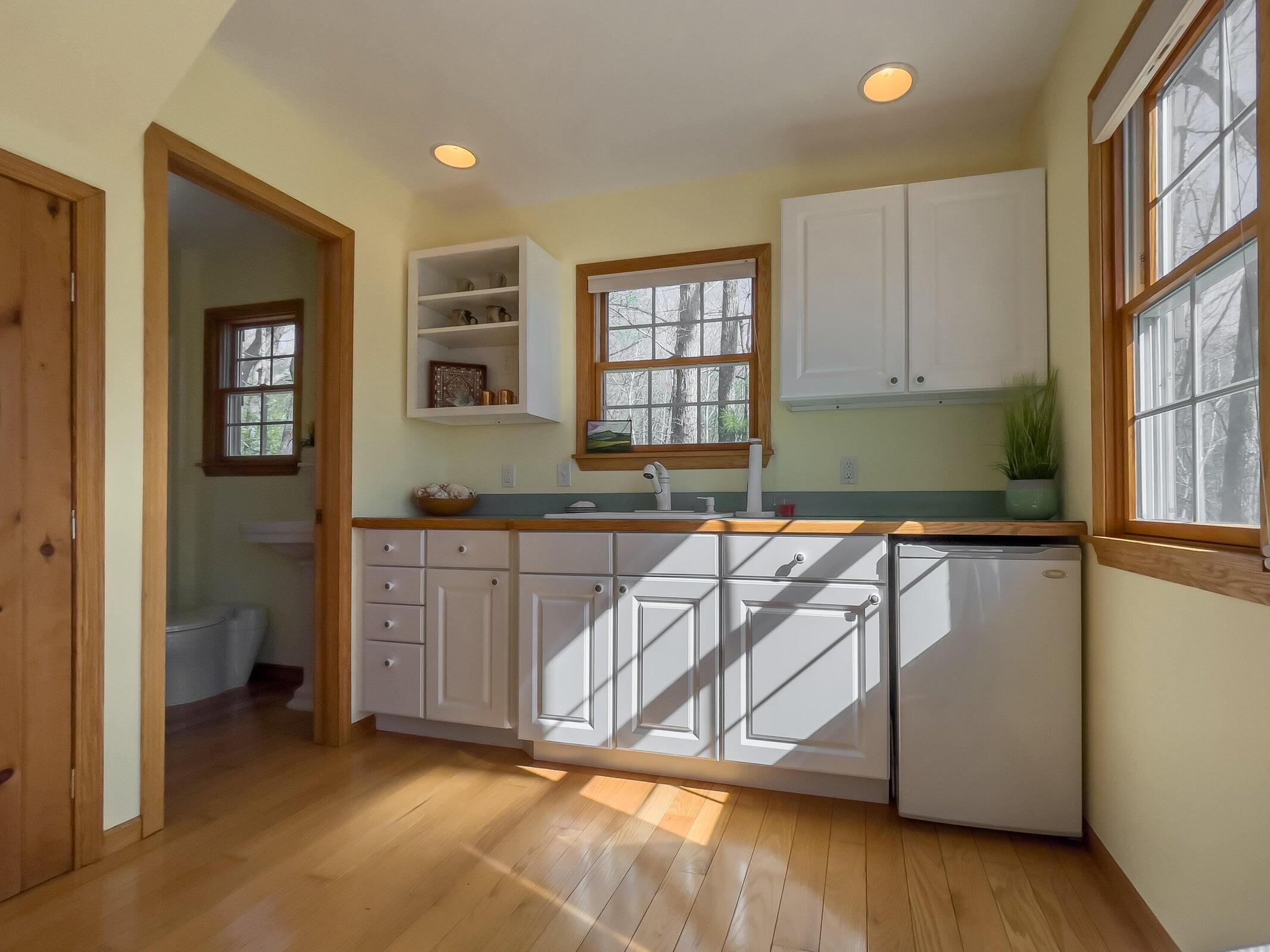 386 Fredericksburg Road Lexington, VA 24450 - Photo 42 of 72 a kitchen with granite countertop a stove a sink and a granite counter top