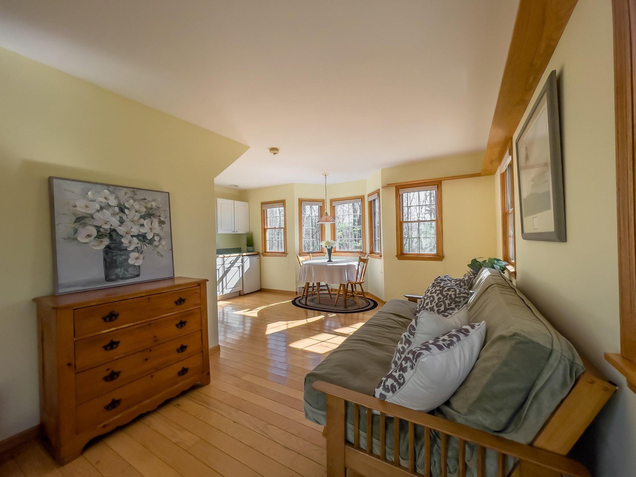 386 Fredericksburg Road Lexington, VA 24450 - Photo 46 of 72 a living room with furniture and a dresser with wooden floor