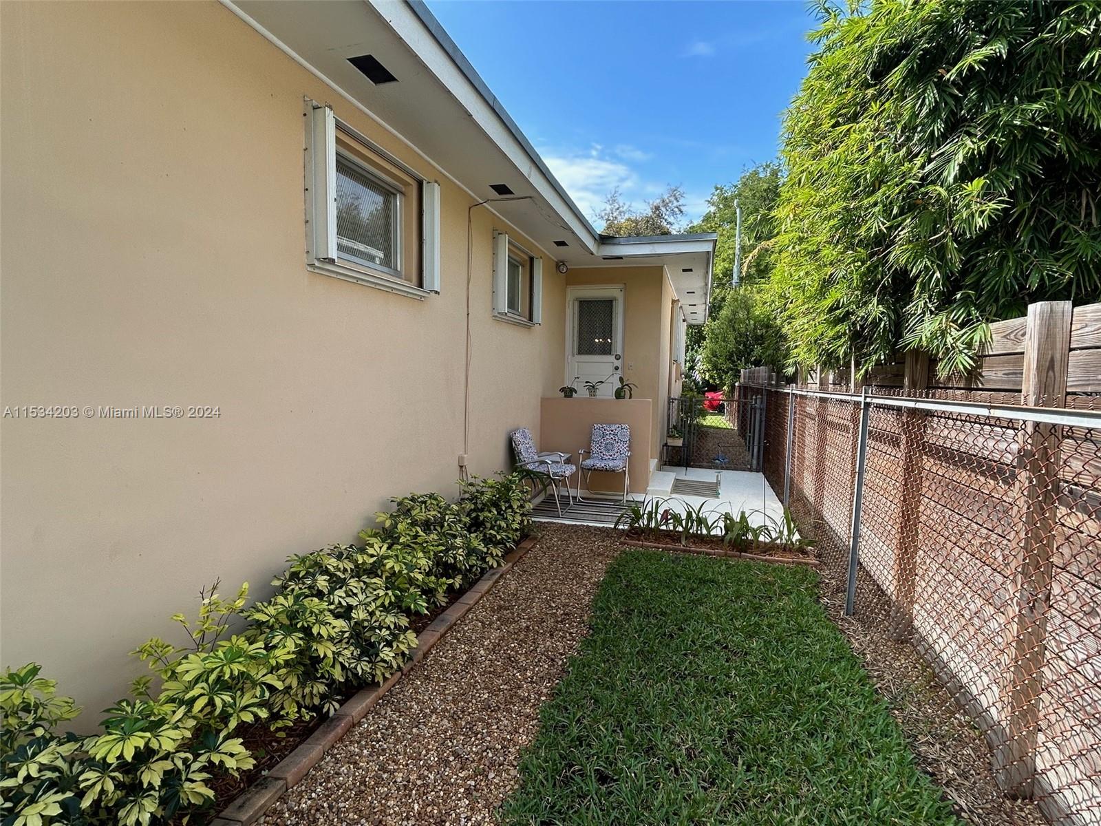 211 Southwest 24th Road Miami, FL 33129 - Photo 22 of 32 a front view of a house with a yard