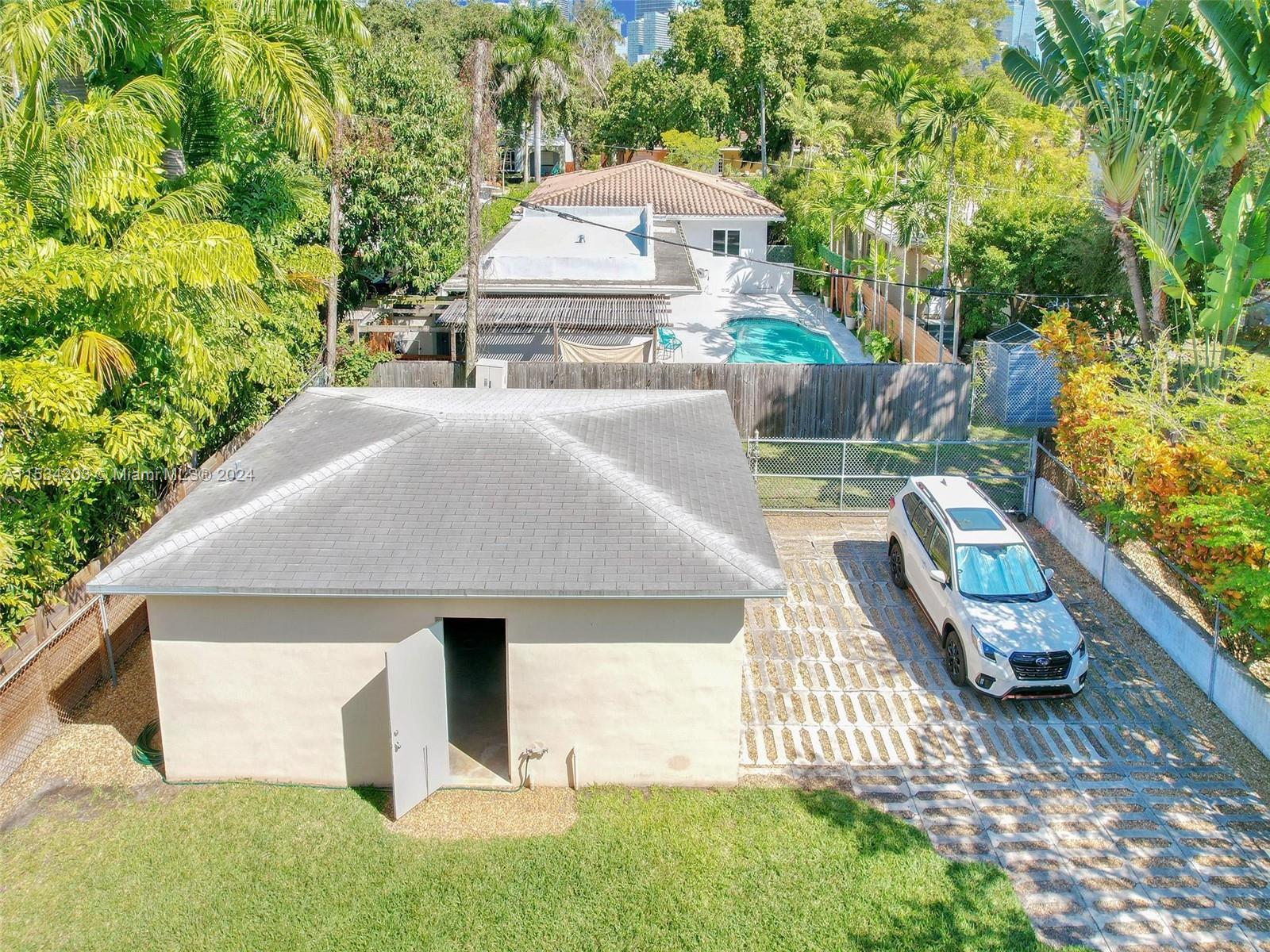 211 Southwest 24th Road Miami, FL 33129 - Photo 27 of 32 a view of a house with a yard