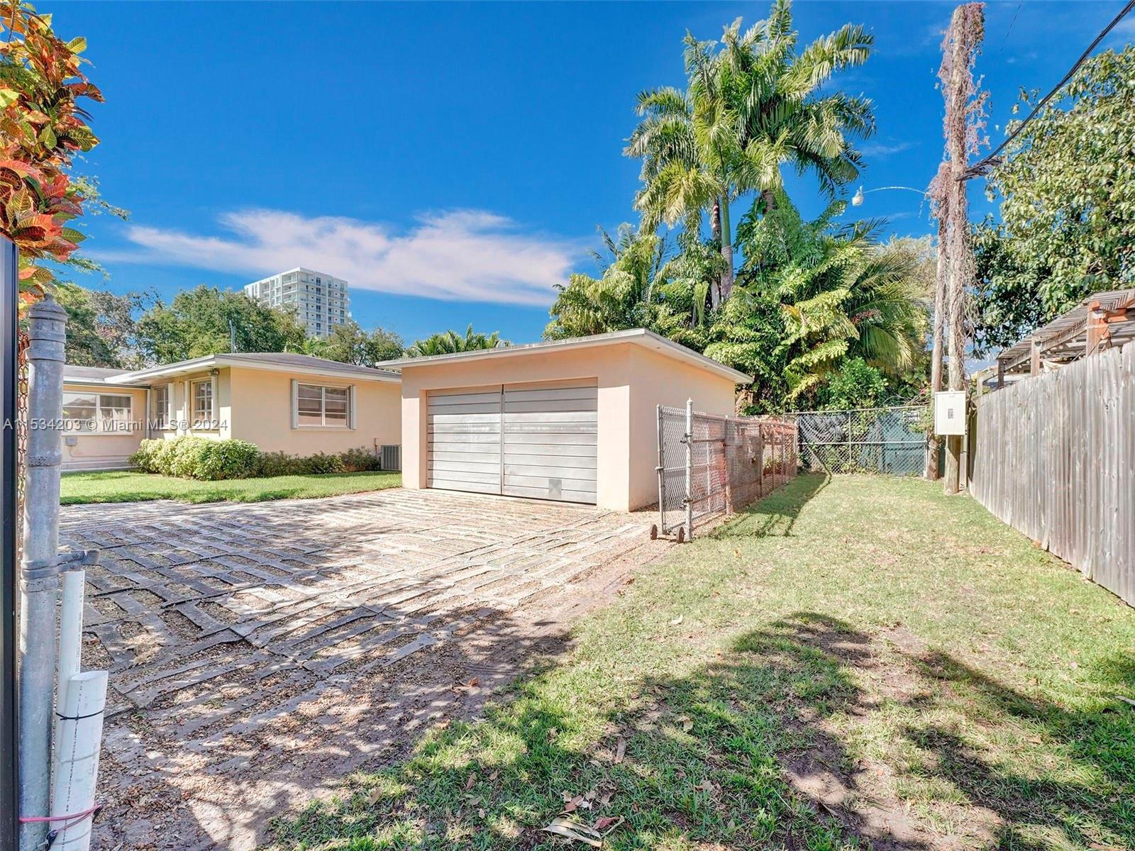 211 Southwest 24th Road Miami, FL 33129 - Photo 28 of 32 a pathway of a house with a yard