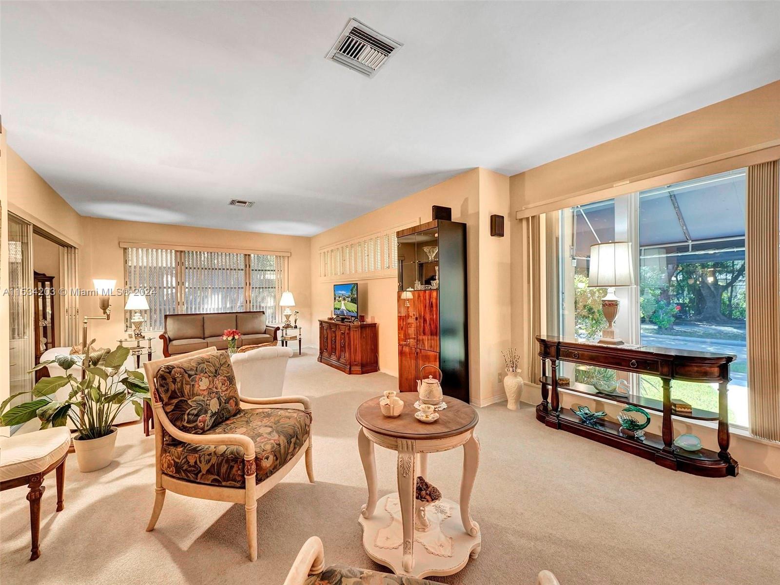 211 Southwest 24th Road Miami, FL 33129 - Photo 7 of 32 a view of a livingroom with furniture and a large window