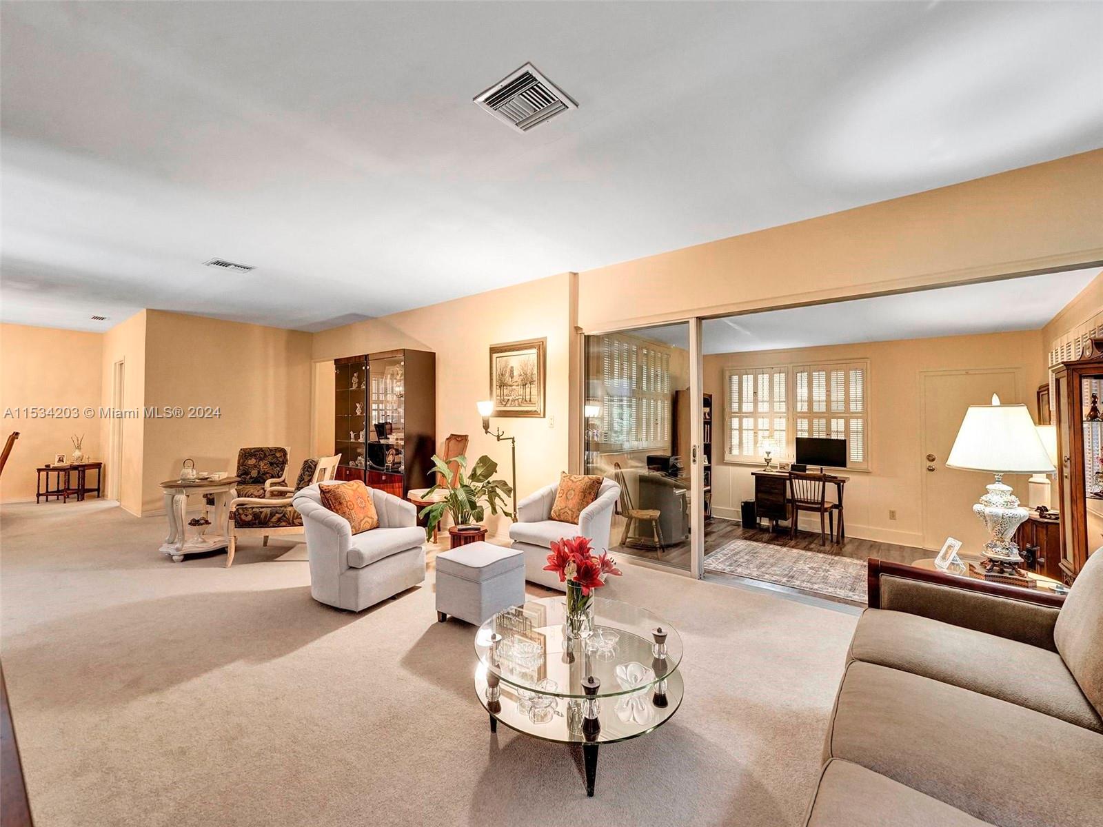 211 Southwest 24th Road Miami, FL 33129 - Photo 9 of 32 a living room with furniture and a large window