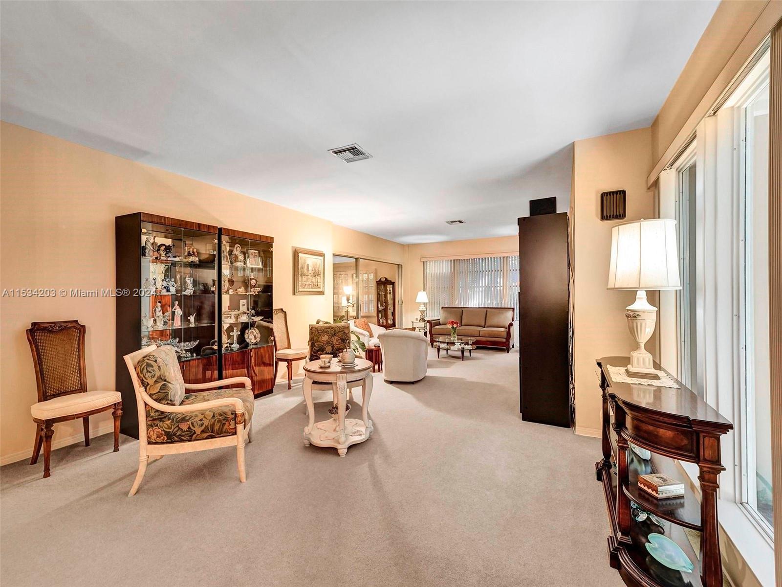 211 Southwest 24th Road Miami, FL 33129 - Photo 10 of 32 a living room with furniture and a large window