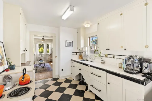 a kitchen with a sink and cabinets