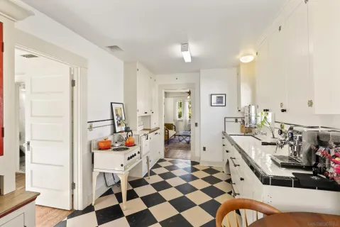 a very nice looking room with a large window and chairs