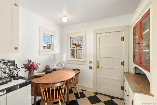a dining room with furniture and window