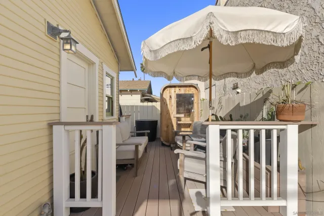 a view of a balcony with furniture