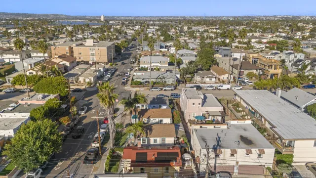 an aerial view of residential houses with city view