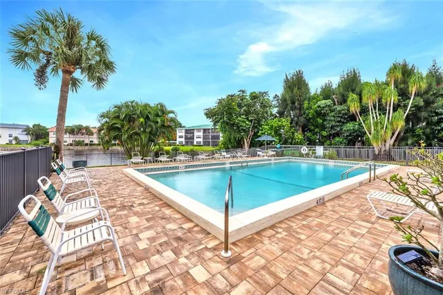 a view of a swimming pool with a lounge chair