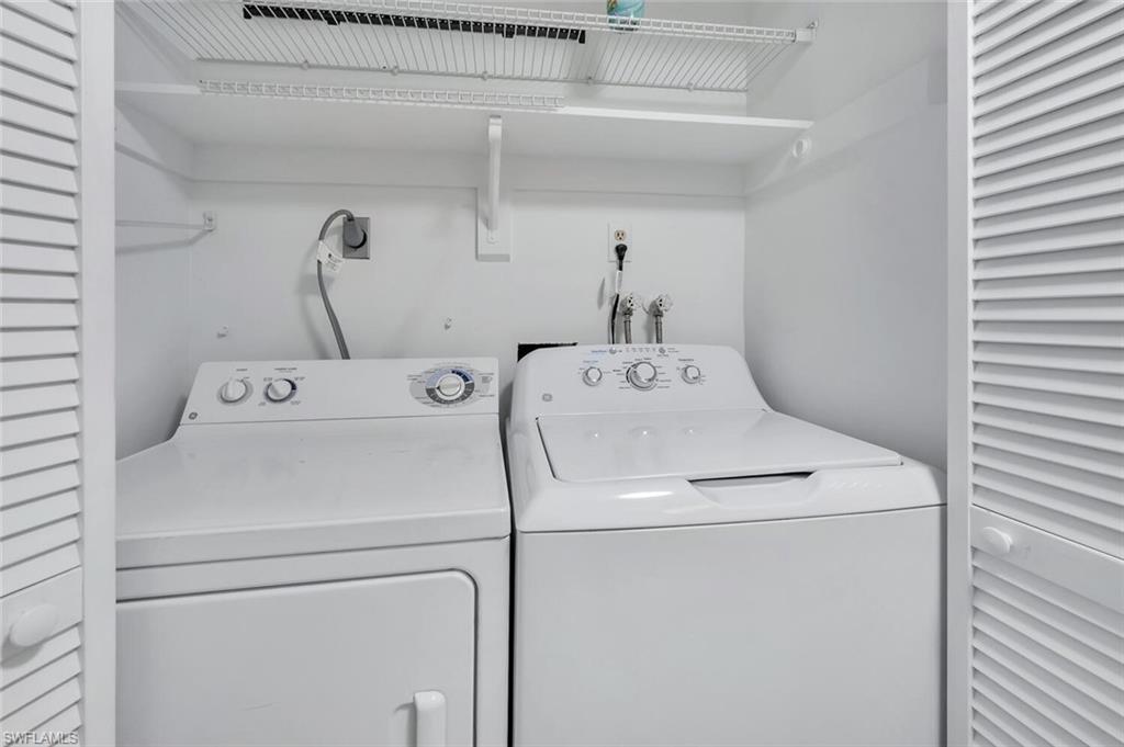 3030 Binnacle Drive, Unit 201 Naples, FL 34103 - Photo 10 of 16 a utility room with dryer and washer