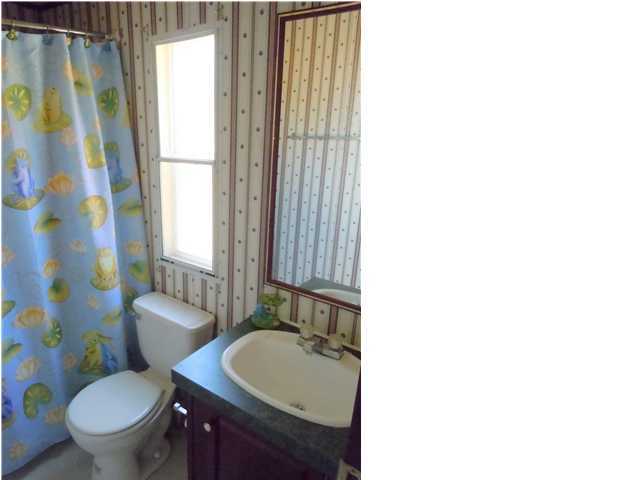 246 Long Road DeFuniak Springs, FL 32433 - Photo 12 of 19 a bathroom with a sink toilet and shower
