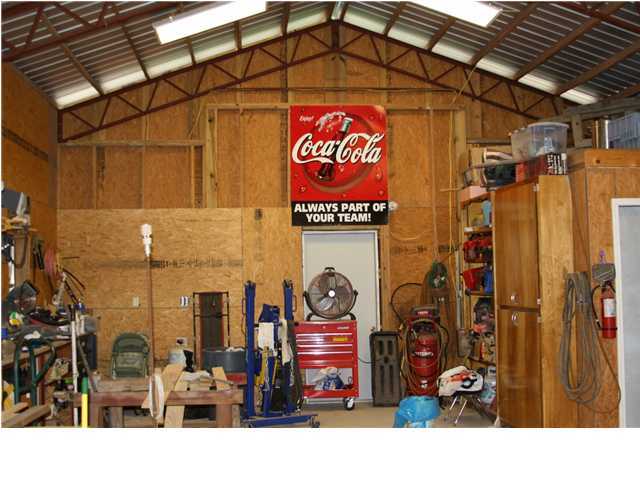 246 Long Road DeFuniak Springs, FL 32433 - Photo 16 of 19 a view of shops in a street