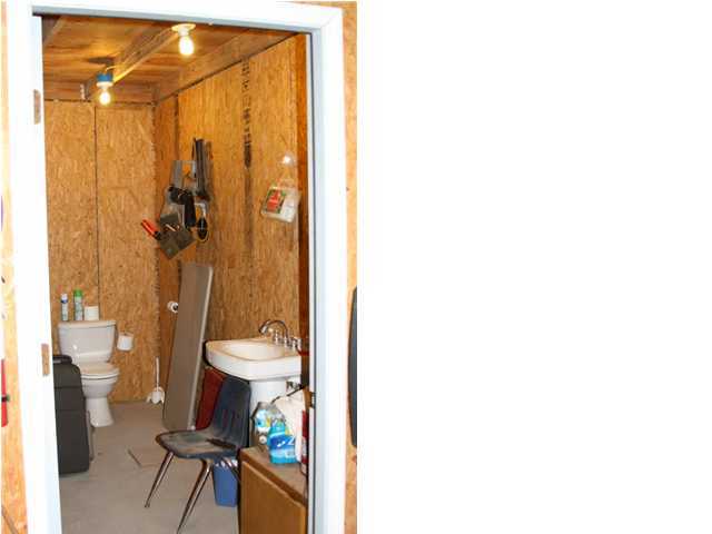 246 Long Road DeFuniak Springs, FL 32433 - Photo 18 of 19 a bathroom with a toilet and a shower curtain