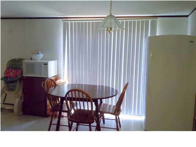 246 Long Road DeFuniak Springs, FL 32433 - Photo 4 of 19 a view of a dining room with furniture and chandelier
