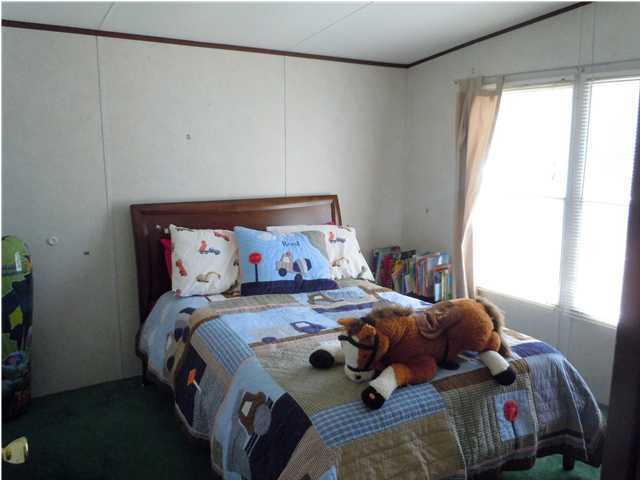 246 Long Road DeFuniak Springs, FL 32433 - Photo 10 of 19 a bedroom with a bed and window