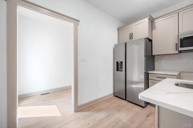 a kitchen with stainless steel appliances a refrigerator and a stove