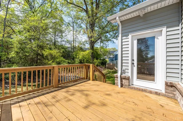 a view of a balcony with wooden floor
