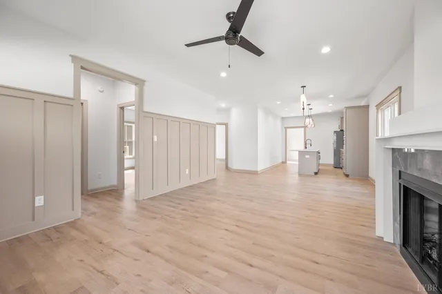 a view of an empty room and a fireplace