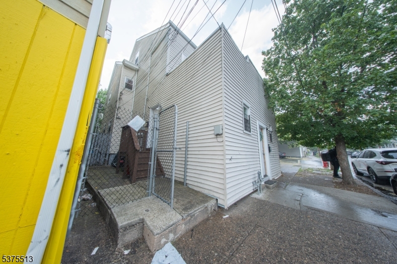 56 North York Street Paterson, NJ 07524 - Photo 1 of 20 a view of a house with backyard and sitting area