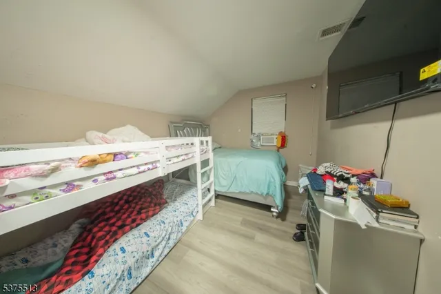 a utility room with a bed and toys