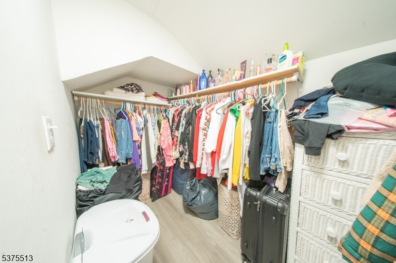 56 North York Street Paterson, NJ 07524 - Photo 17 of 20 a view of walk in closet with clothes and shoes