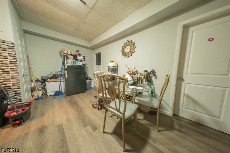 56 North York Street Paterson, NJ 07524 - Photo 4 of 20 a view of a dining room with furniture and wooden floor
