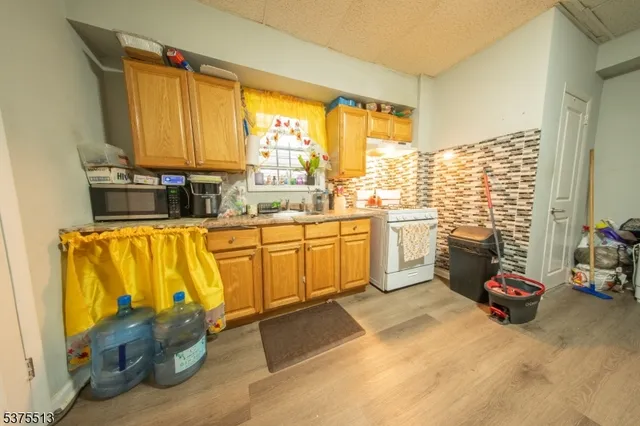 a kitchen with sink cabinets and outdoor seating