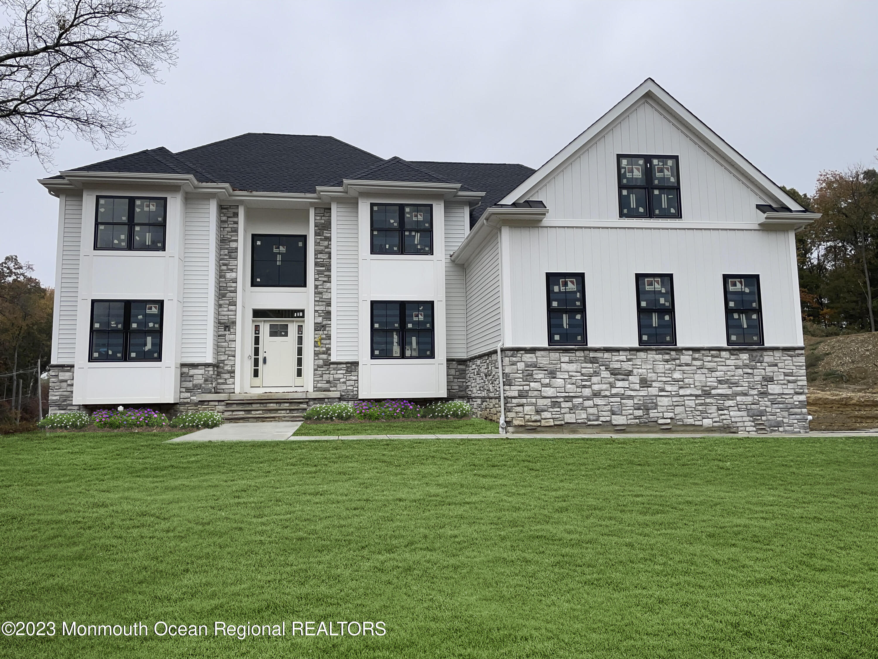 a front view of a house with a yard