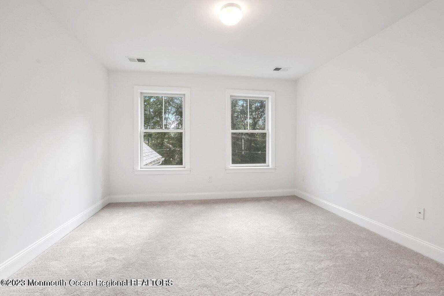 2 Crine Road Morganville, NJ 07751 - Photo 11 of 15 an empty room with windows