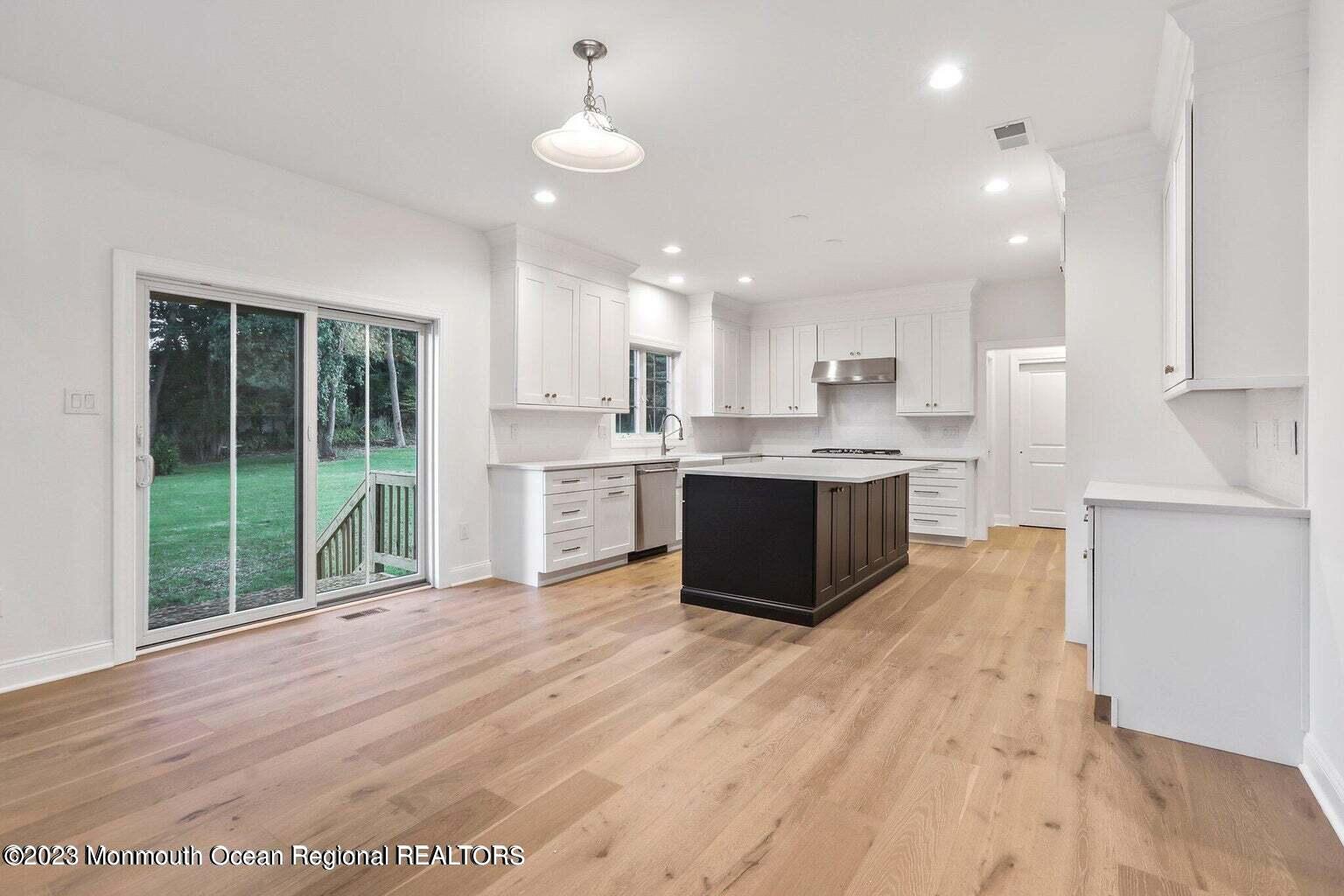 2 Crine Road Morganville, NJ 07751 - Photo 5 of 15 a view of kitchen with granite countertop cabinets and a sink