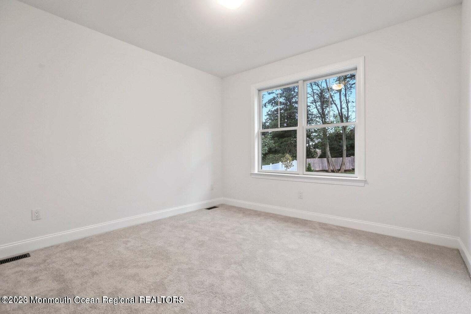 2 Crine Road Morganville, NJ 07751 - Photo 9 of 15 an empty room with windows