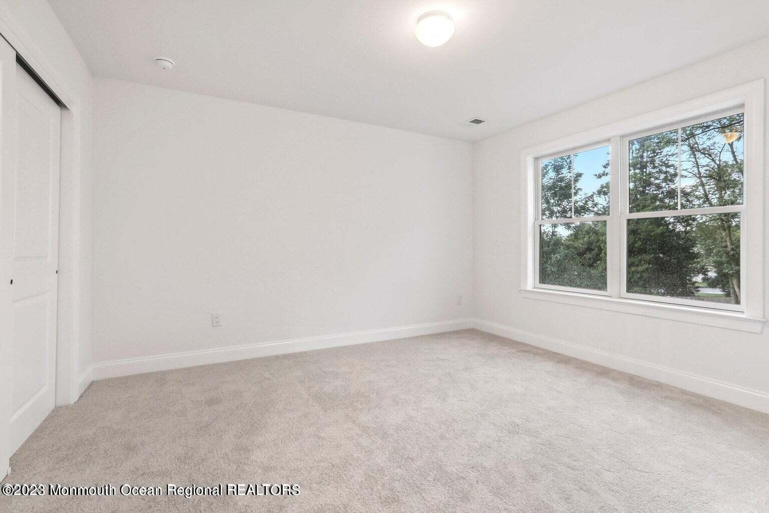 2 Crine Road Morganville, NJ 07751 - Photo 10 of 15 a view of an empty room with a window