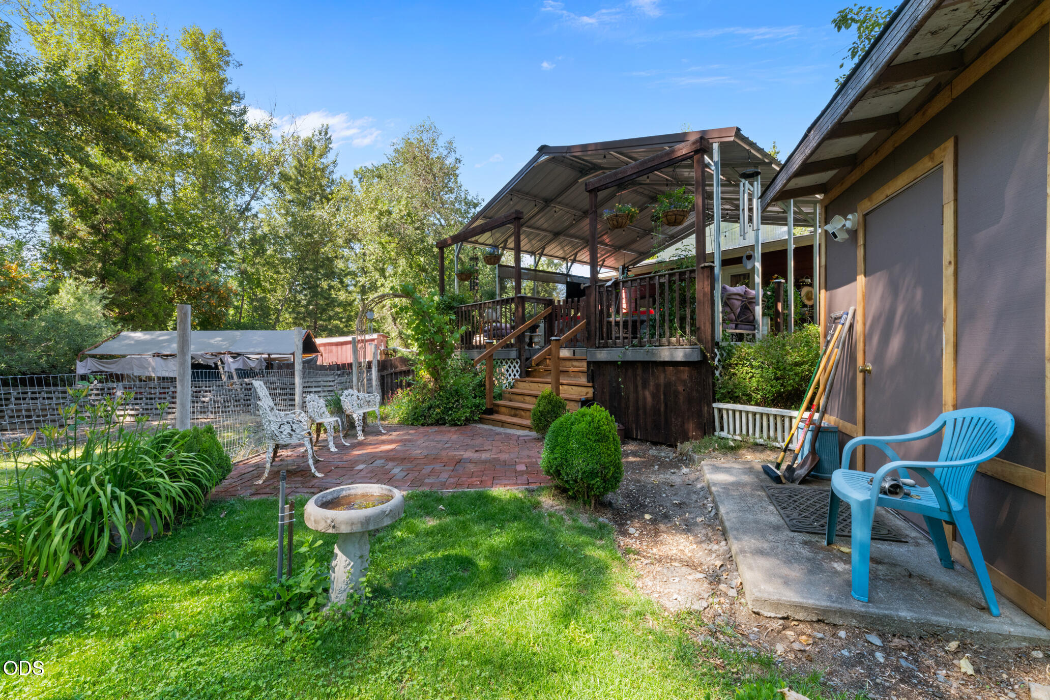 690 Foots Creek Road Gold Hill, OR 97525 - Photo 26 of 45 a backyard of a house with table and chairs