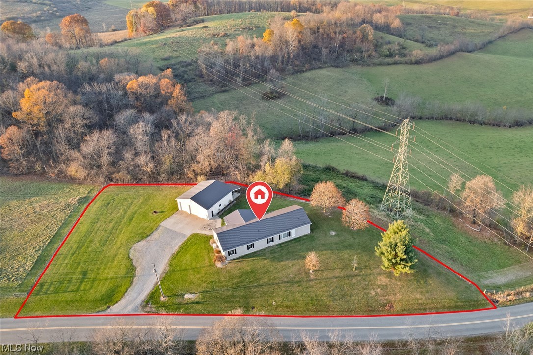 Birds eye view of property featuring a rural view