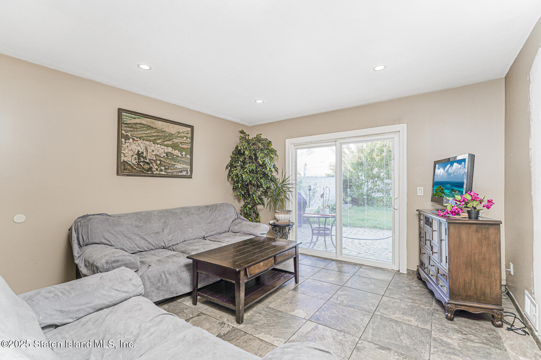 31 Plank Road Staten Island, NY 10314 - Photo 17 of 30 a living room with furniture and a gate