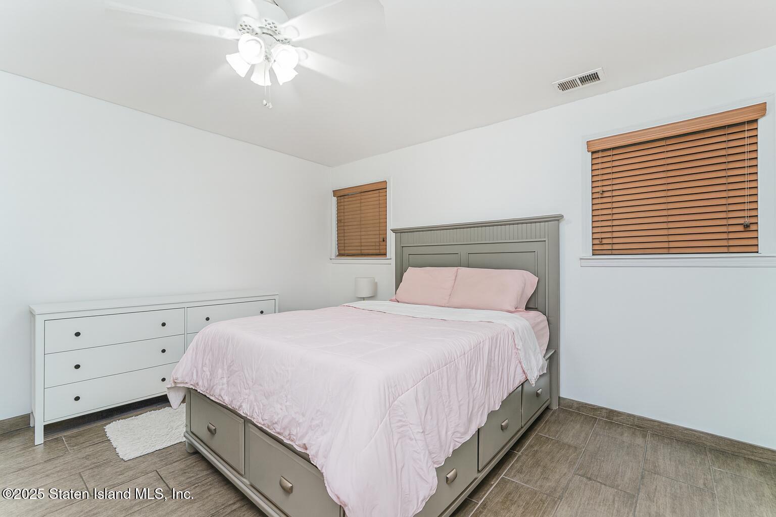 31 Plank Road Staten Island, NY 10314 - Photo 22 of 30 a bedroom with a bed and a window