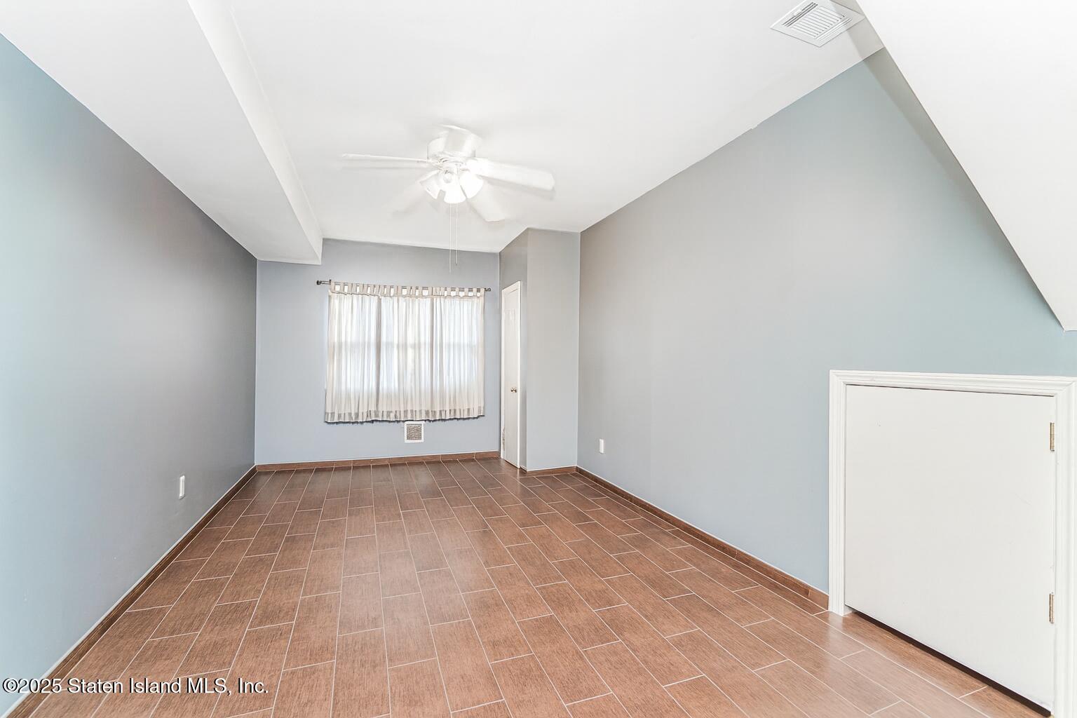 31 Plank Road Staten Island, NY 10314 - Photo 26 of 30 a view of an empty room with a window