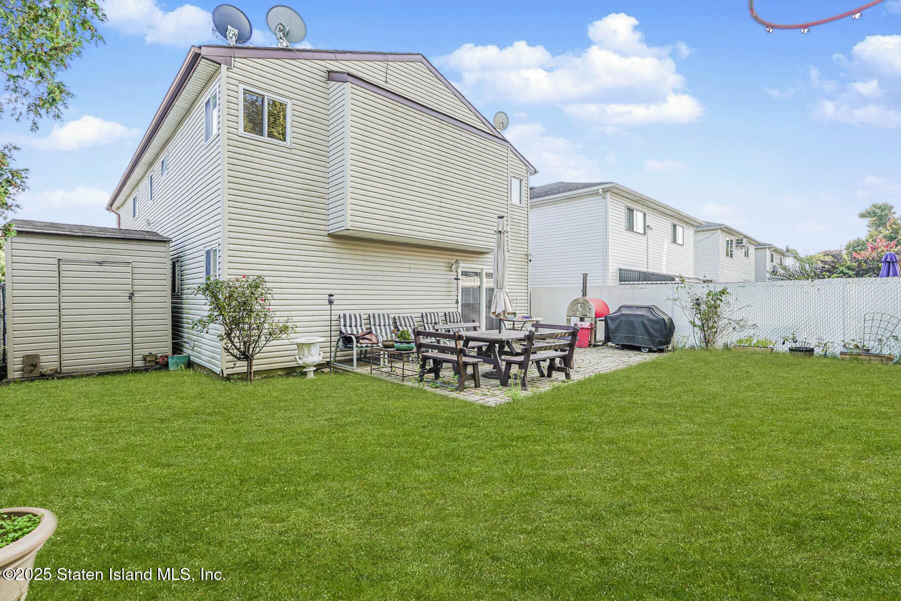 31 Plank Road Staten Island, NY 10314 - Photo 5 of 30 a view of a house with backyard and sitting area