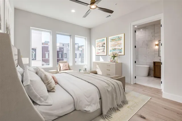 a bathroom with a double vanity sink toilet and shower