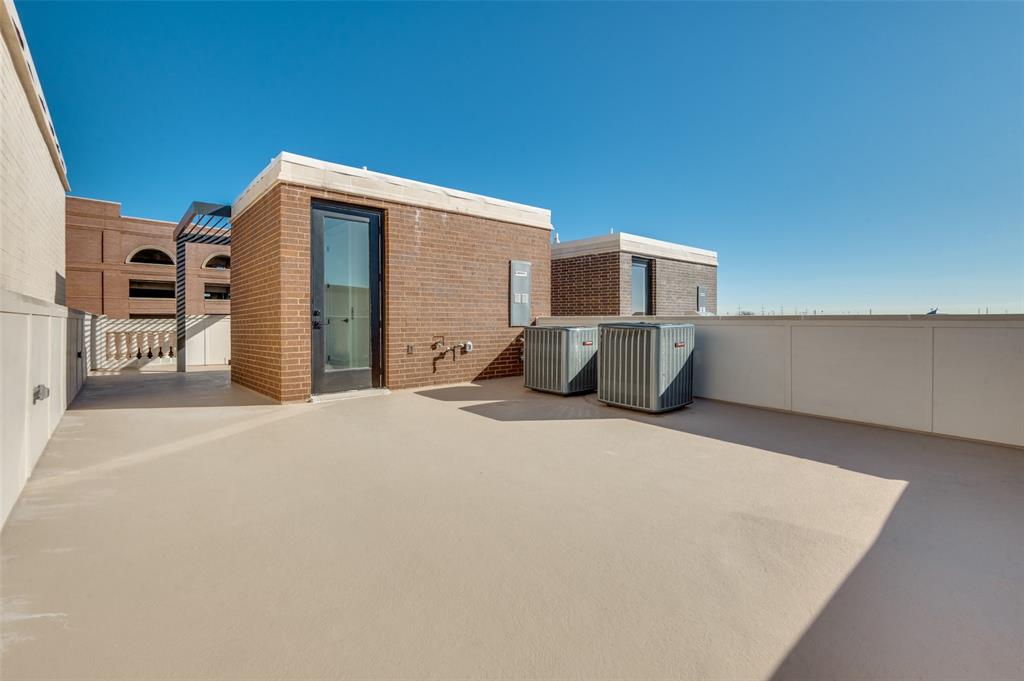 250 East Dallas Road, Unit 124 Grapevine, TX 76051 - Photo 25 of 37 Back side of rooftop patio