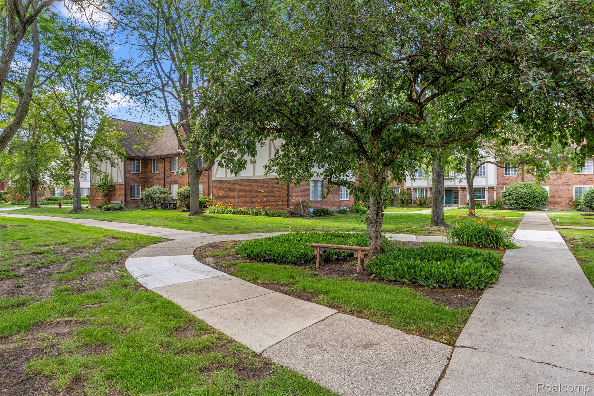 30220 Southfield Road Southfield, MI 48076 - Photo 5 of 13 Expansive green spaces featuring mature trees and established landscaping